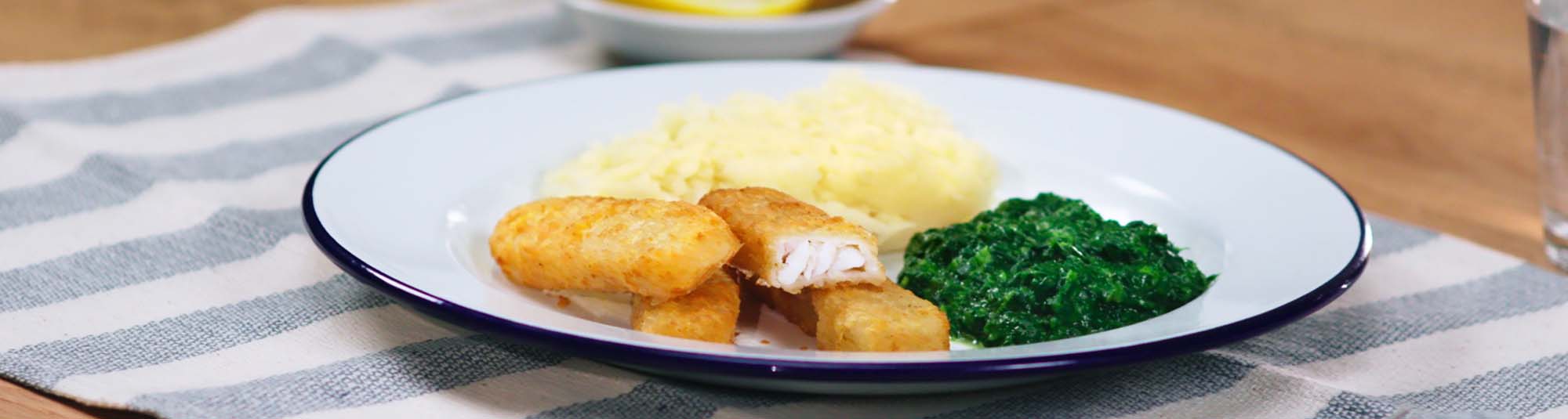 battered fish fingers with mash spinach