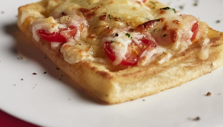 Birds Eye Potato Waffles with melted cheese and tomato